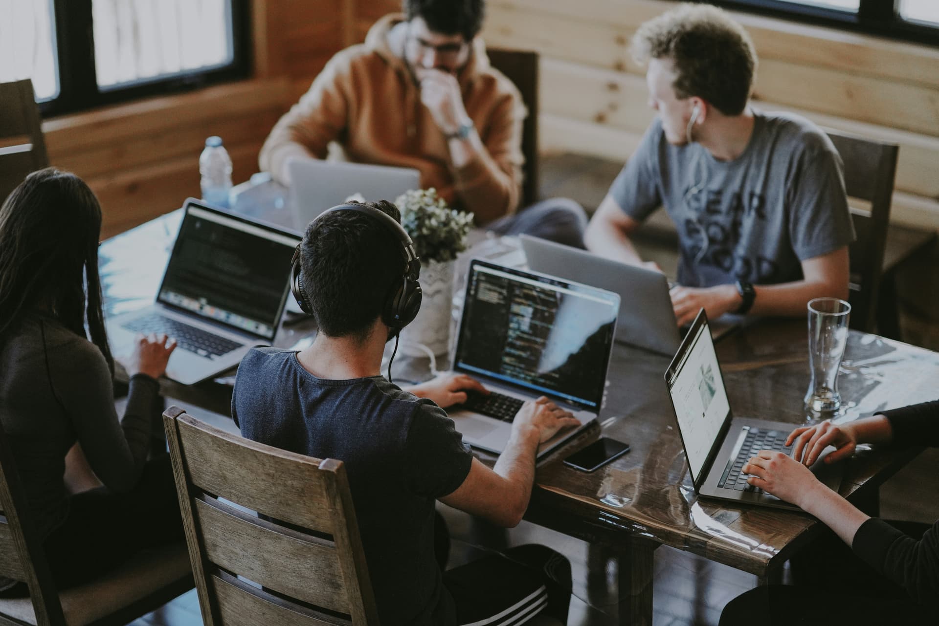 Arya Softwtech Team - Collaborative developers and designers in modern workspace